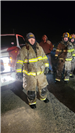 01.15.2024 Equipment Operator Shane Rowell with Firefighters Cary Smith and Caleb Wood in the backgr