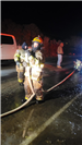 01.15.2024 Firefighter Samantha Alwan (helmet) with Equipment Operator Katalina Finley standing behi