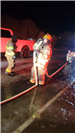 01.15.2024 Firefighter Samantha Alwan (helmet) with Equipment Operator Katalina Finley standing behi