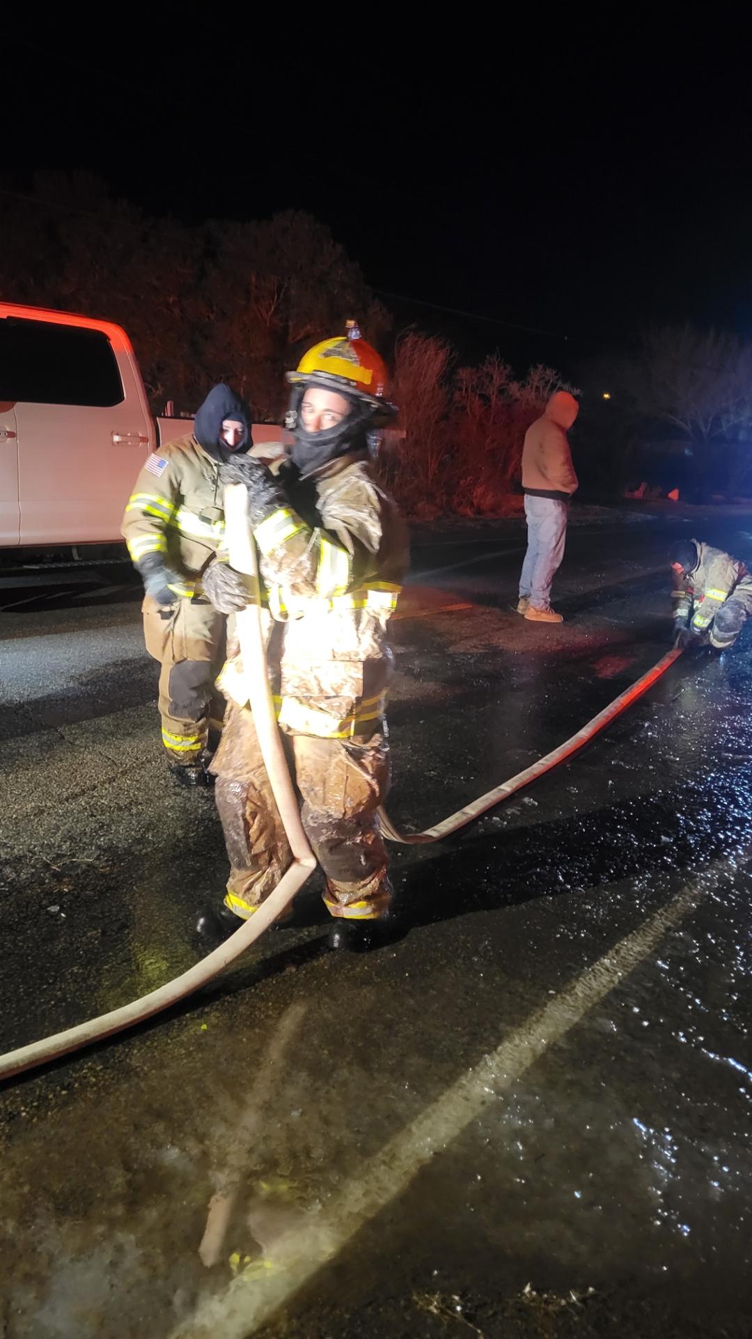 01.15.2024 Firefighter Samantha Alwan (helmet) with Equipment Operator Katalina Finley standing behi