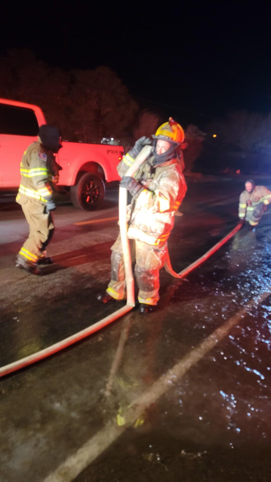 01.15.2024 Firefighter Samantha Alwan (helmet) with Equipment Operator Katalina Finley standing behi